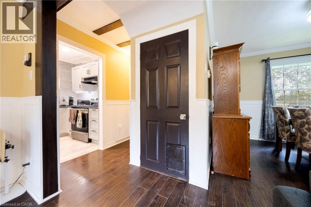 Hardwood-finish flooring, wainscoting, and exposed ceiling beams - 102 Stewart Avenue, Cambridge, ON