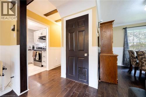 Hardwood-finish flooring, wainscoting, and exposed ceiling beams - 102 Stewart Avenue, Cambridge, ON 