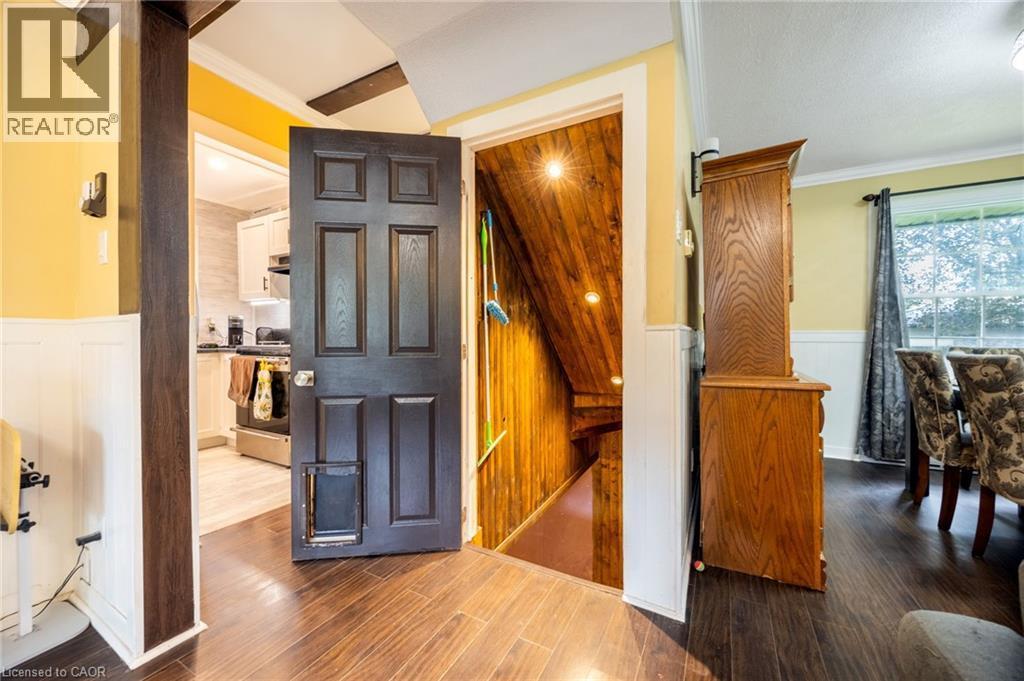 Rich wood-finish flooring throughout the main level - 102 Stewart Avenue, Cambridge, ON