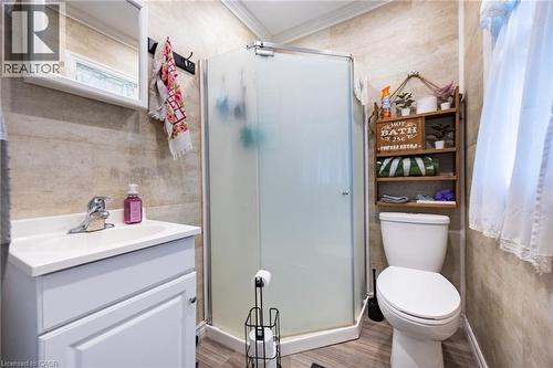 White vanity with an integrated sink and chrome faucet - 102 Stewart Avenue, Cambridge, ON 