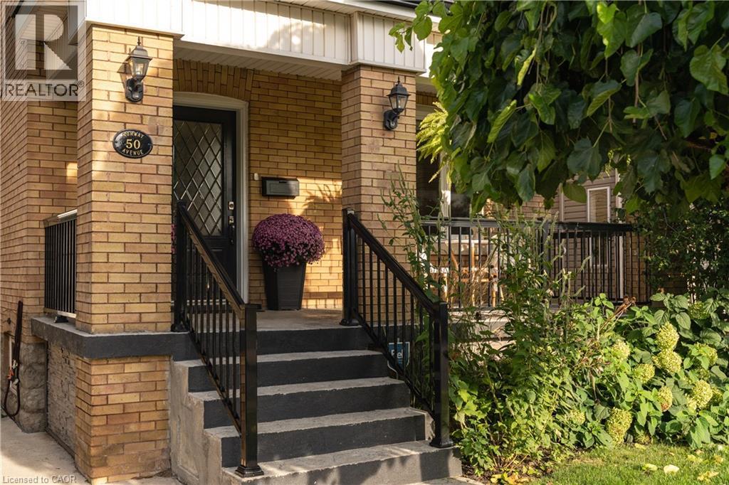 Brick facade with black exterior lighting fixtures - 50 Norway Avenue, Hamilton, ON