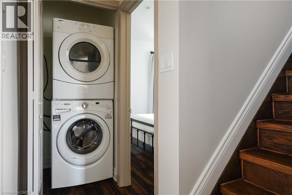 Stacked white washer and dryer unit - 50 Norway Avenue, Hamilton, ON
