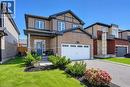 Brick and siding exterior with dark trim accents - 428 Freure Drive, Cambridge, ON 