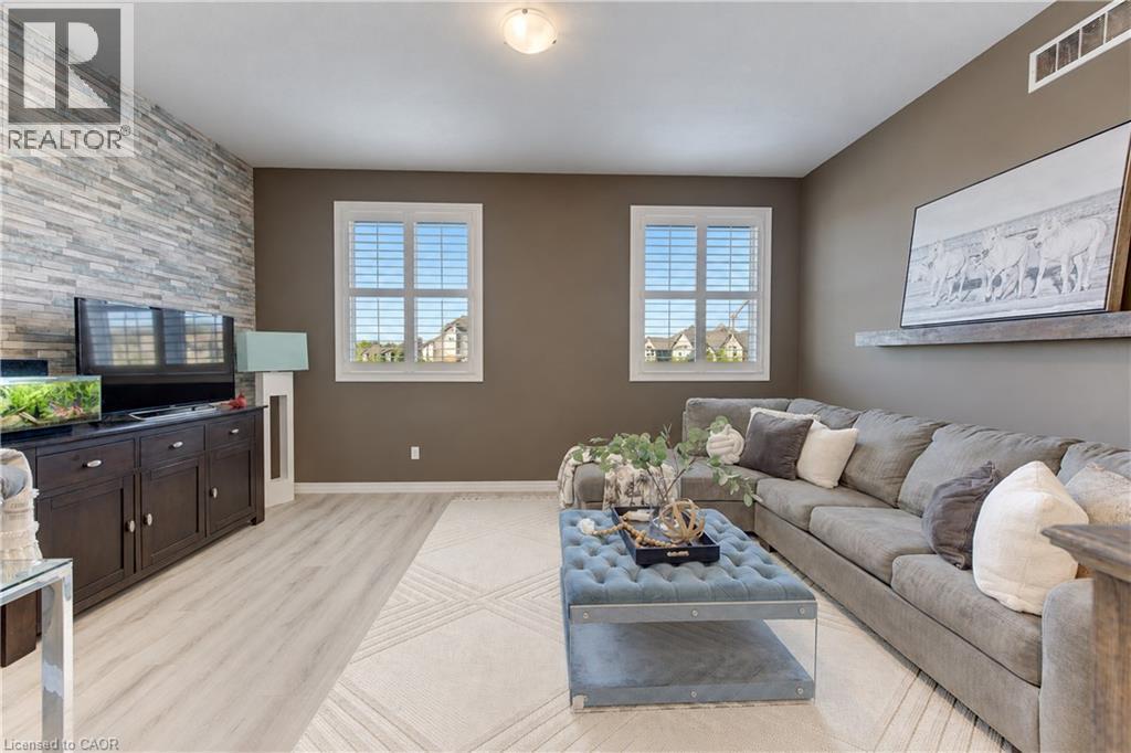 Accent wall featuring stacked stone - 428 Freure Drive, Cambridge, ON