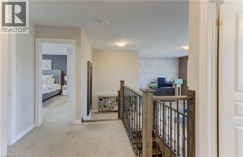 Plush carpeted hallway with recessed lighting - 428 Freure Drive, Cambridge, ON