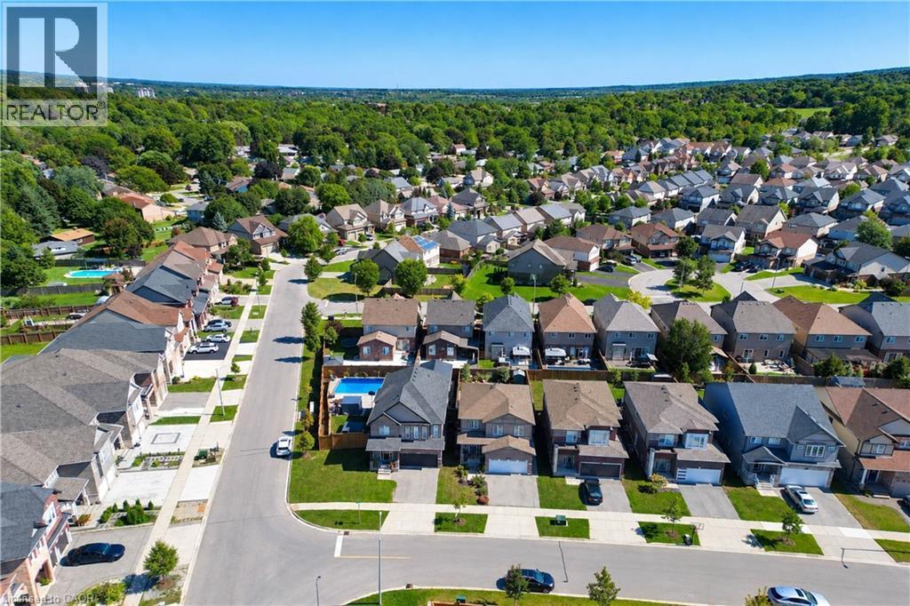 Residential neighborhood featuring multiple single-family homes with pitched roofs and attached garages - 428 Freure Drive, Cambridge, ON