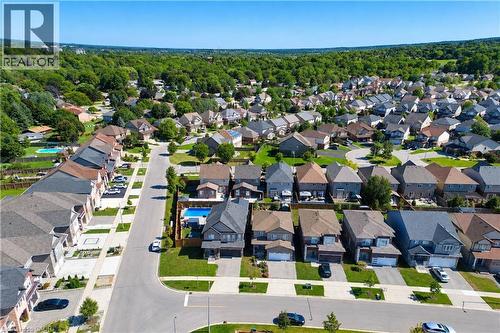 Residential neighborhood featuring multiple single-family homes with pitched roofs and attached garages - 428 Freure Drive, Cambridge, ON 