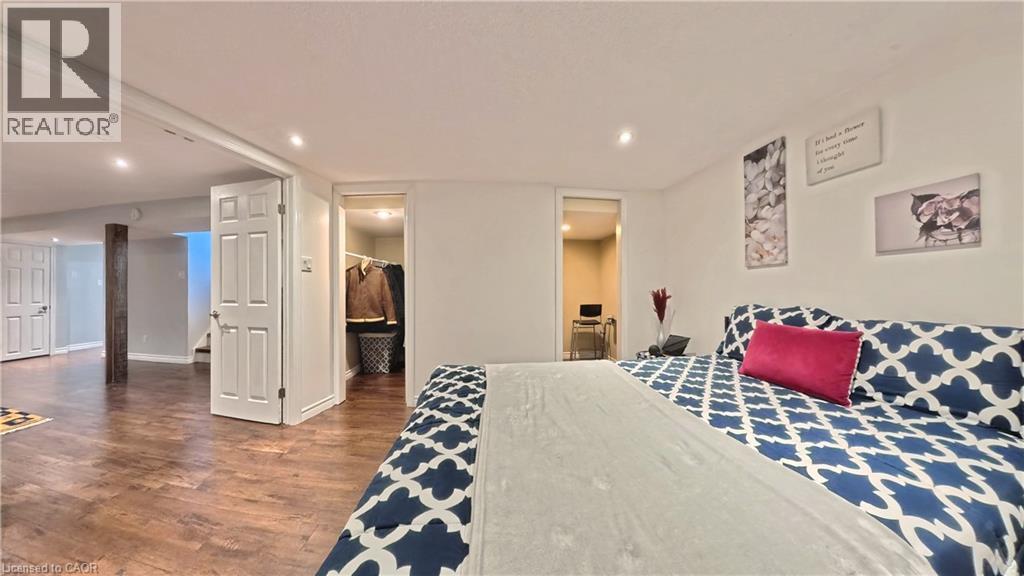 Recessed lighting, wood-finish flooring, white paneled doors, and a built-in closet with shelving - 380 Grangewood Drive, Waterloo, ON