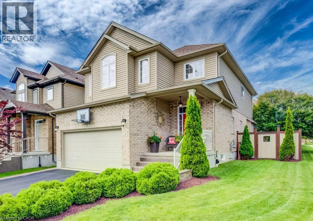Traditional two-story home featuring a brick and siding facade - 300 Watervale Crescent, Kitchener, ON
