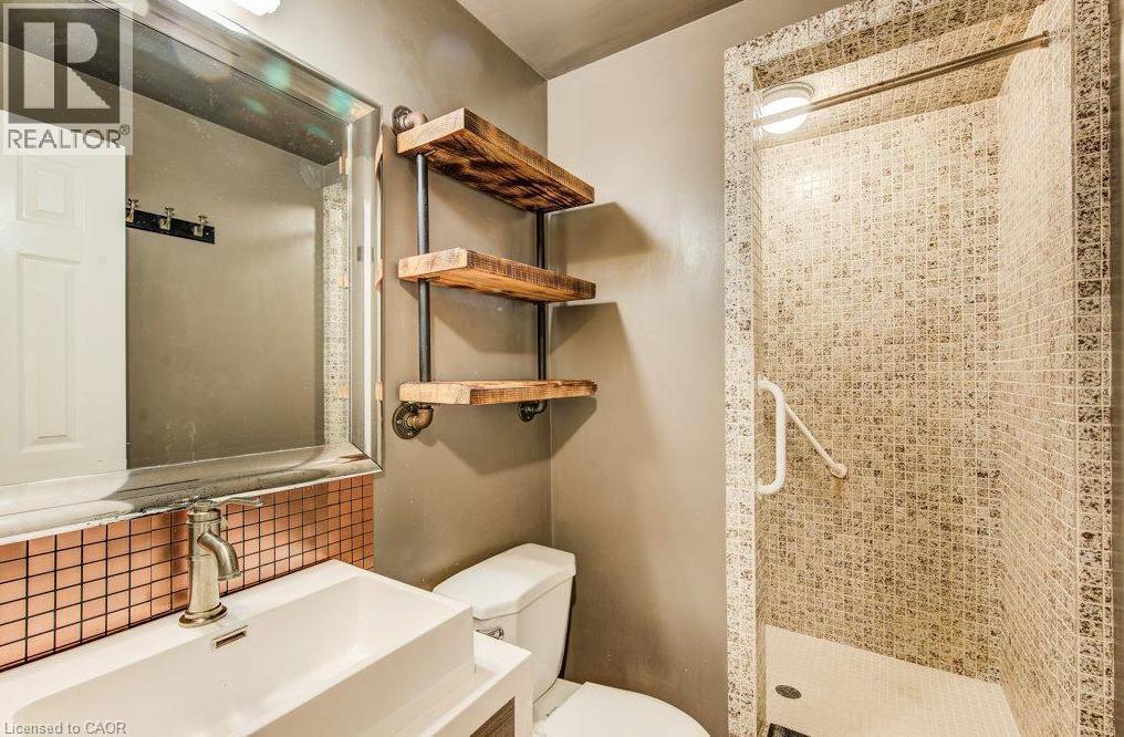 Walk-in shower with mosaic tile surround. - 109 White Oak Place, Waterloo, ON - Indoor Photo Showing Bathroom
