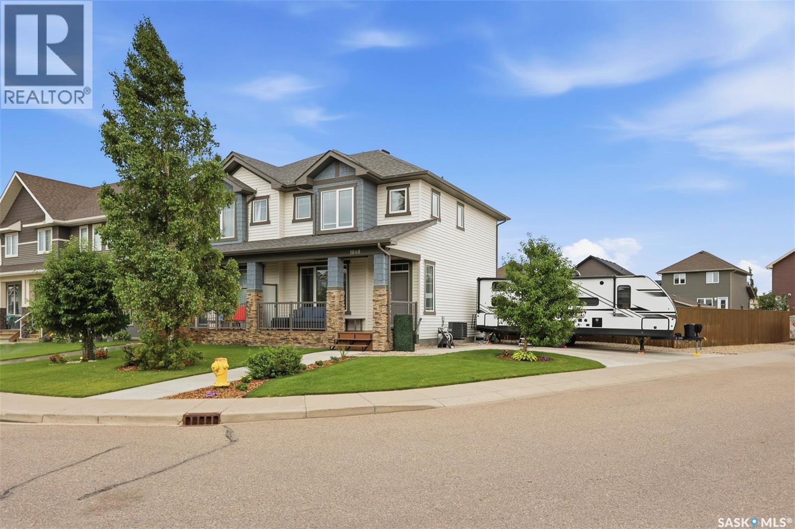 1040 Kolynchuk Crescent, Saskatoon, SK - Outdoor With Deck Patio Veranda With Facade