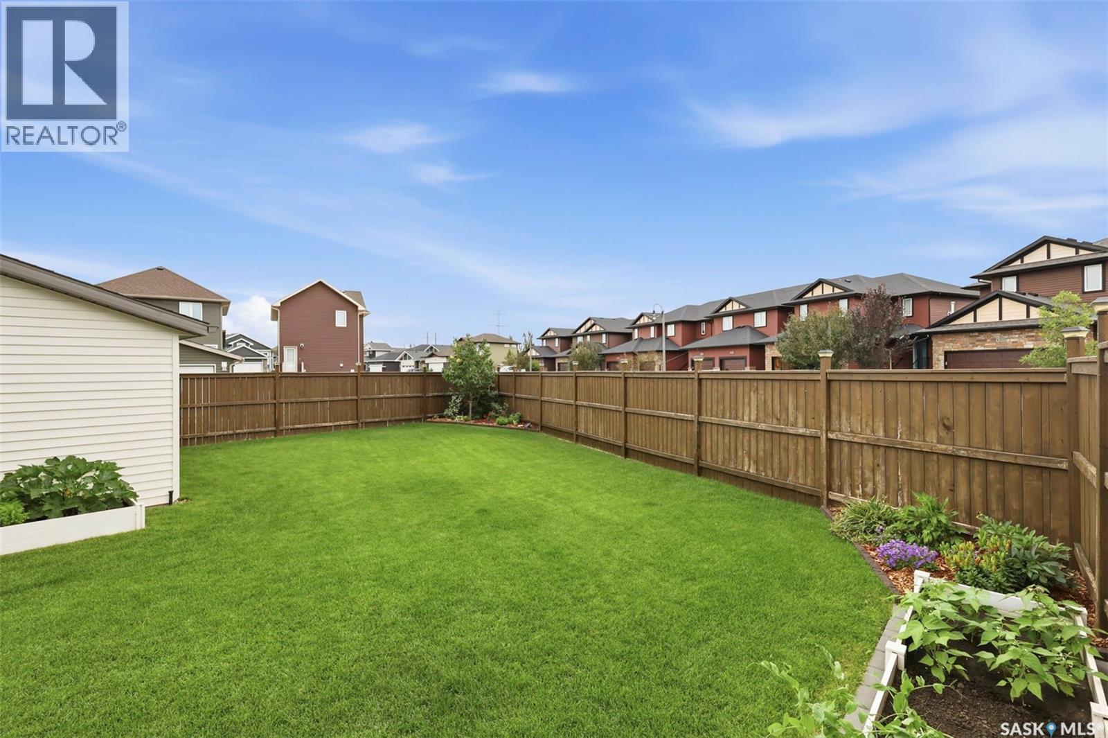 1040 Kolynchuk Crescent, Saskatoon, SK - Outdoor With Backyard
