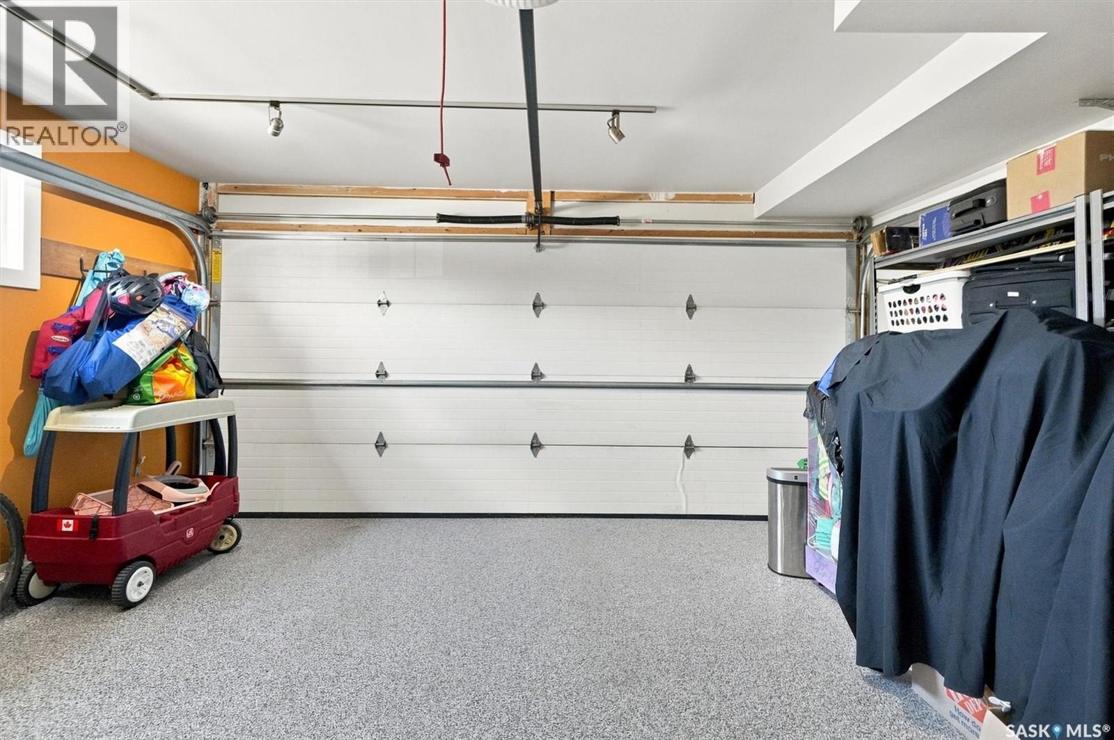 703 Meadows Boulevard, Saskatoon, SK - Indoor Photo Showing Garage
