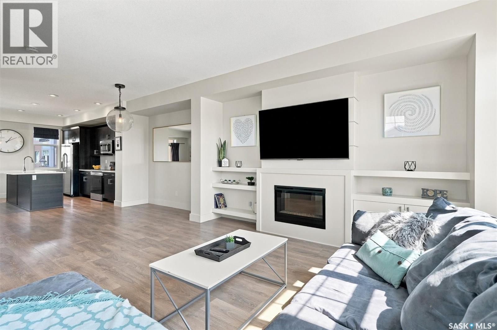703 Meadows Boulevard, Saskatoon, SK - Indoor Photo Showing Living Room With Fireplace