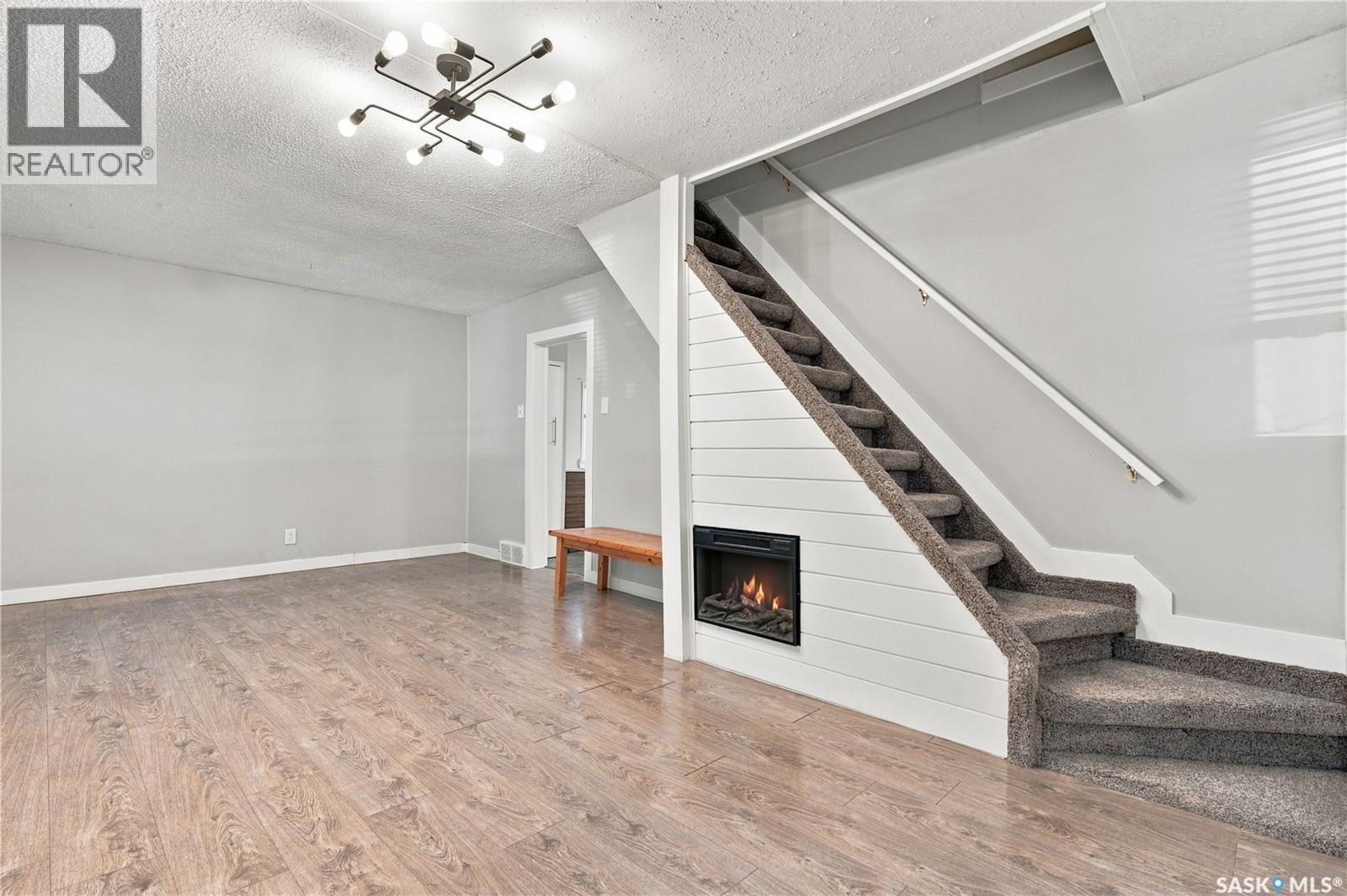 423 E Avenue S, Saskatoon, SK - Indoor Photo Showing Other Room With Fireplace