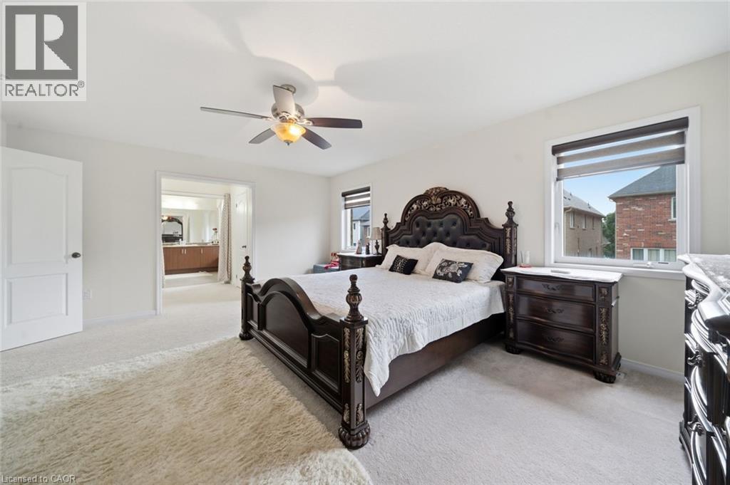 Recessed lighting, ceiling fan with light fixture, carpeted flooring, and architectural interior door - 57 Cheevers Road, Brantford, ON - Indoor Photo Showing Bedroom