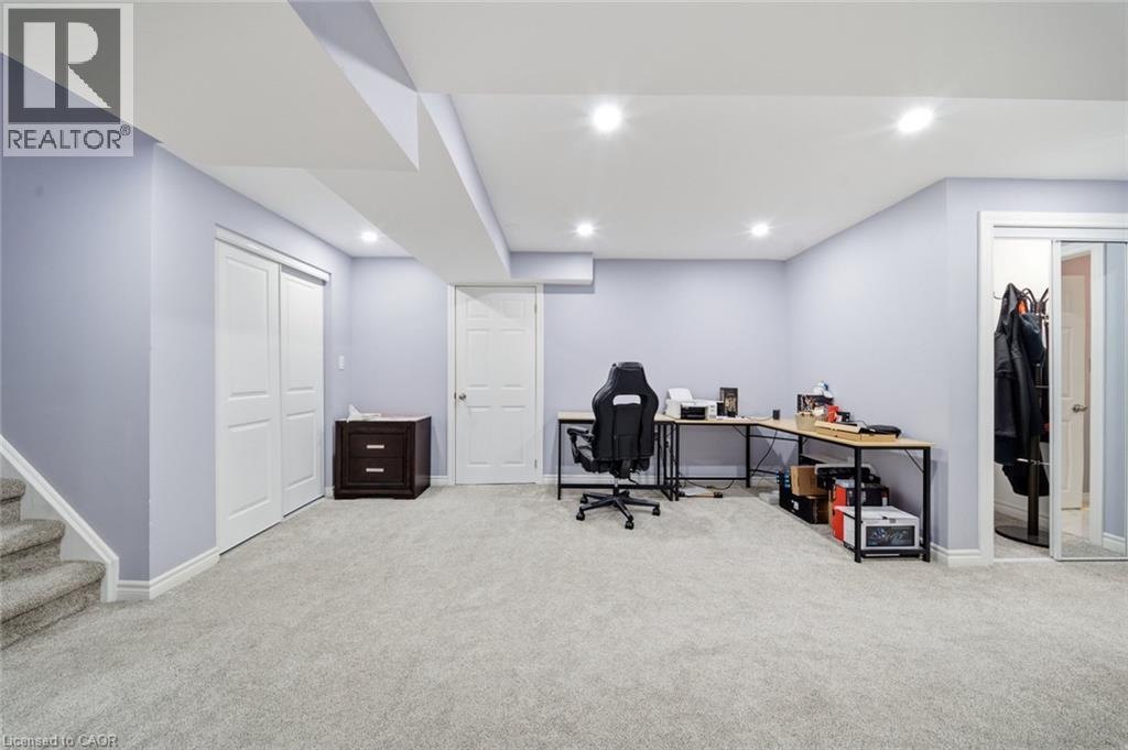 Spacious room featuring light-colored walls, recessed ceiling lighting, and soft carpet flooring - 57 Cheevers Road, Brantford, ON - Indoor