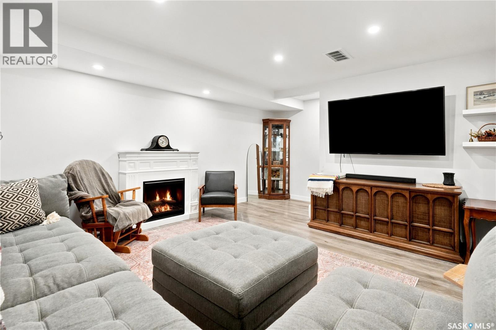5485 Cade Street E, Regina, SK - Indoor Photo Showing Living Room With Fireplace