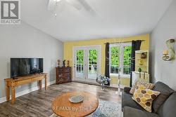 Living Area with French Doors to Back Deck & Yard - 