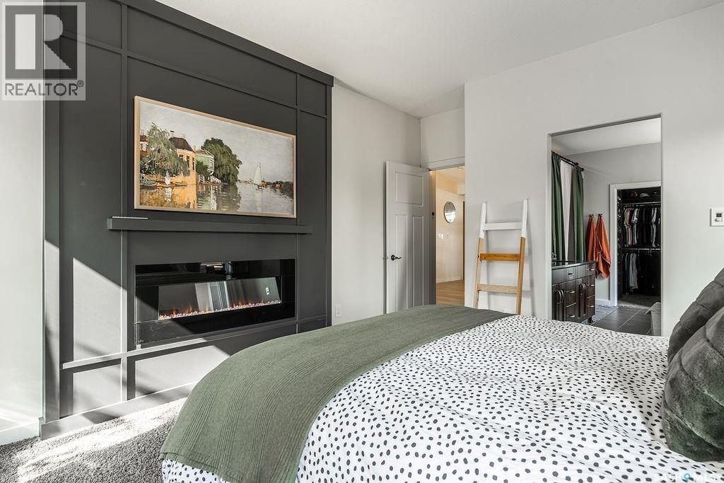 410 Willowgrove Crescent, Saskatoon, SK - Indoor Photo Showing Bedroom With Fireplace