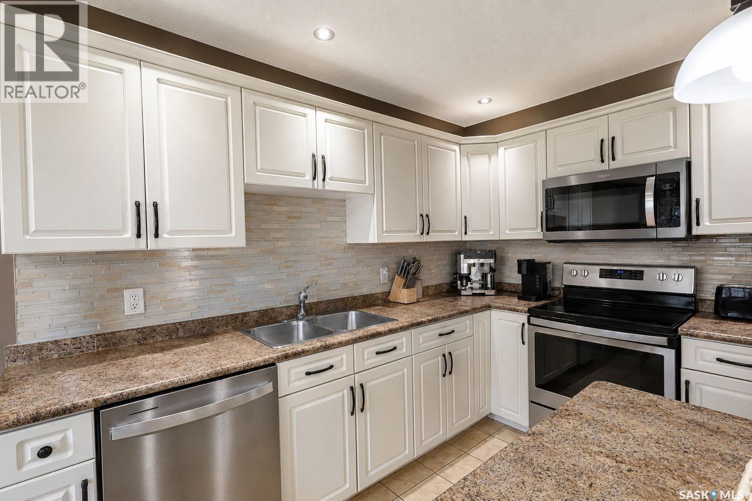53 1600 Muzzy Drive, Prince Albert, SK - Indoor Photo Showing Kitchen With Double Sink