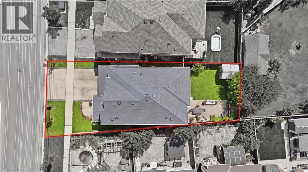 Expansive lot featuring a large driveway, established landscaping, and a manicured lawn - 738 Fourth Line, Milton, ON - Other