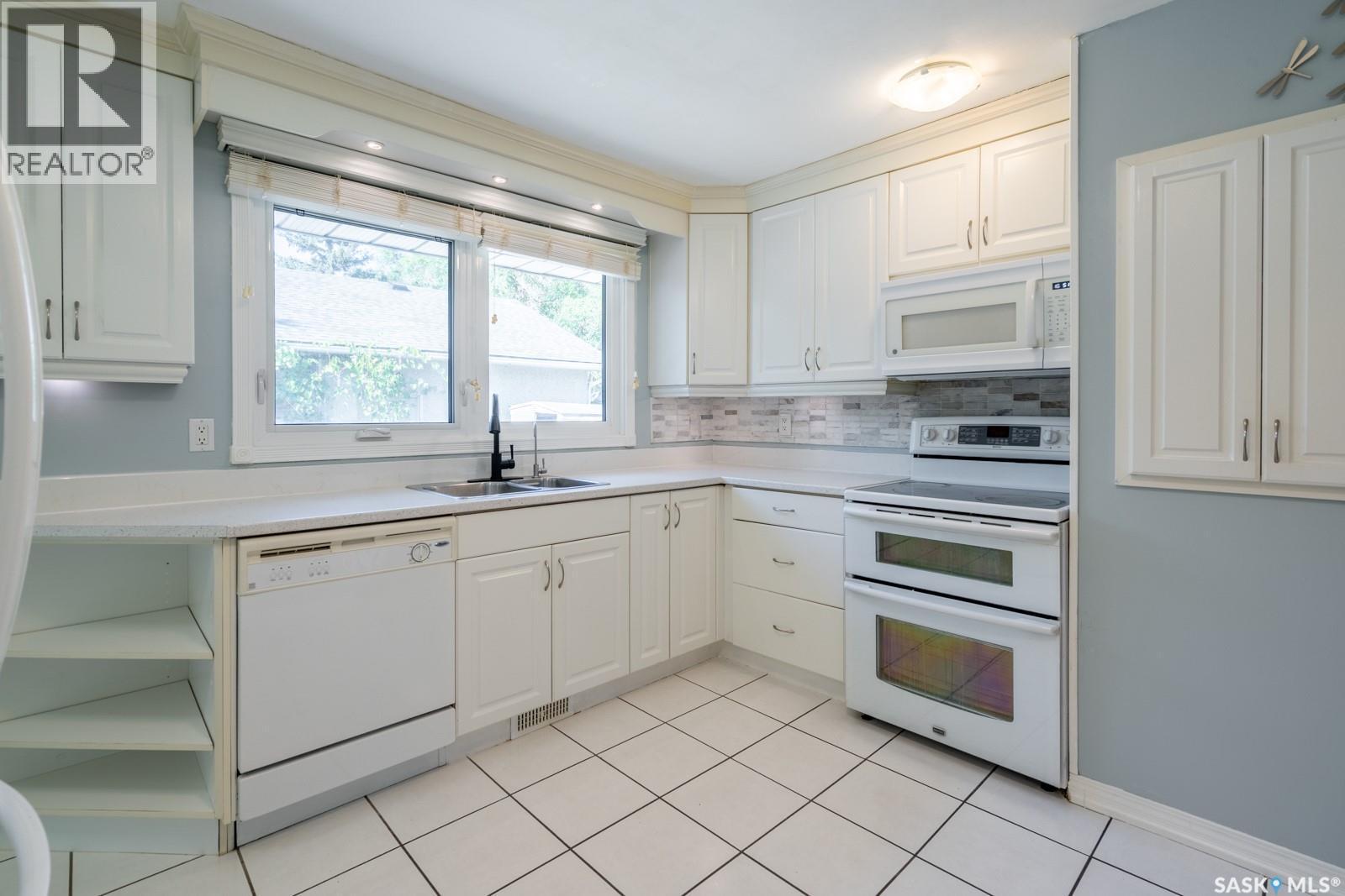 24 Mayfair Crescent, Regina, SK - Indoor Photo Showing Kitchen With Double Sink