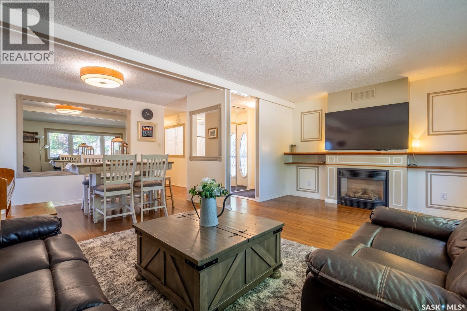 24 Mayfair Crescent, Regina, SK - Indoor Photo Showing Living Room With Fireplace