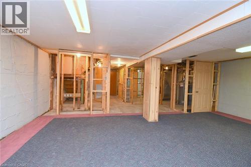 Unfinished basement area with exposed wood framing, concrete block walls, and existing overhead lighting - 575 Upper Wentworth Street, Hamilton, ON - Indoor Photo Showing Other Room