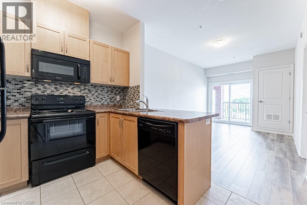3200 Regional Road 56 Unit# 310, Binbrook, ON - Indoor Photo Showing Kitchen With Double Sink