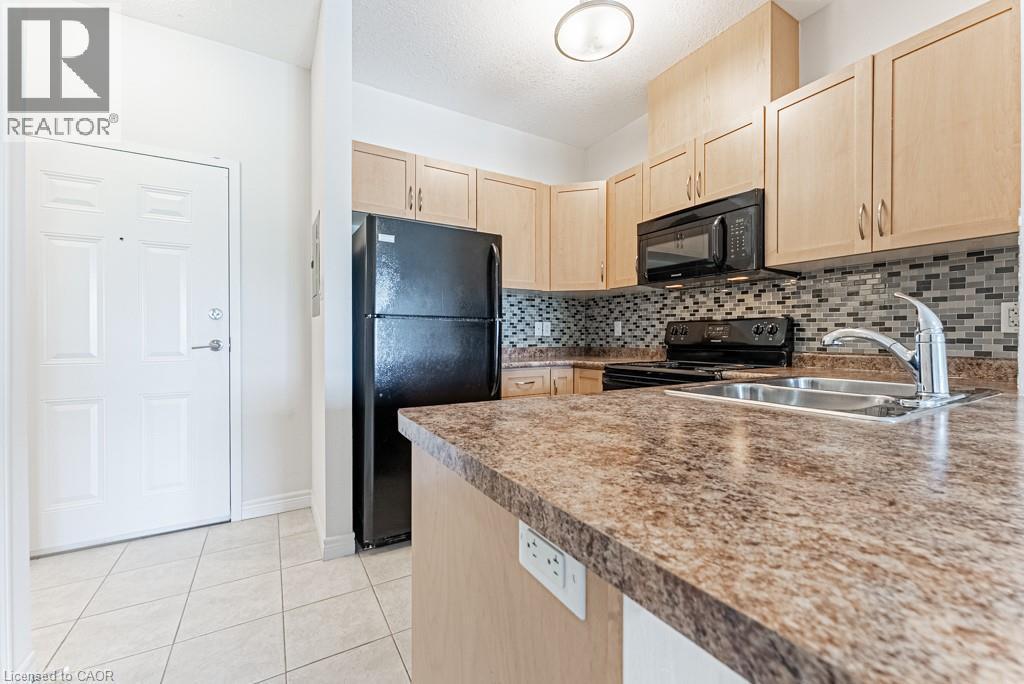 3200 Regional Road 56 Unit# 310, Binbrook, ON - Indoor Photo Showing Kitchen With Double Sink