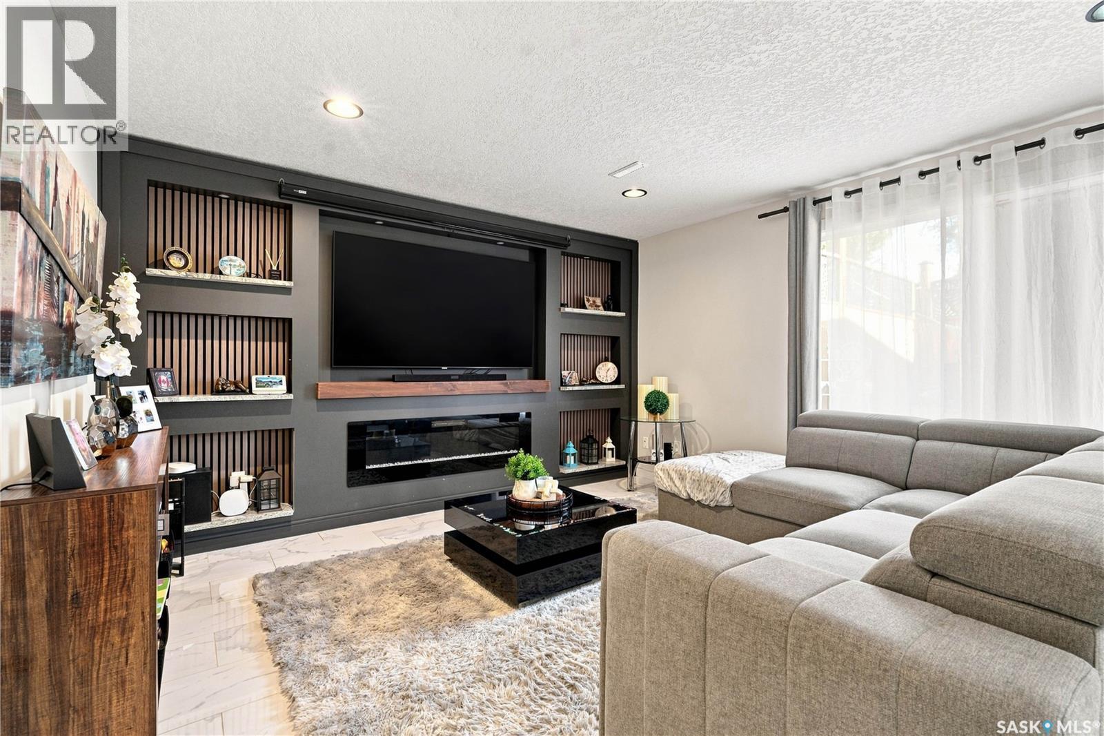 107 Hall Crescent, Saskatoon, SK - Indoor Photo Showing Living Room With Fireplace