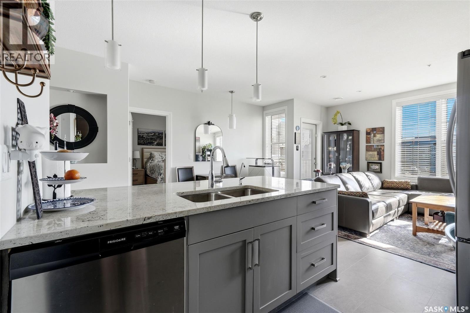 206 1715 Badham Boulevard, Regina, SK - Indoor Photo Showing Kitchen With Double Sink With Upgraded Kitchen
