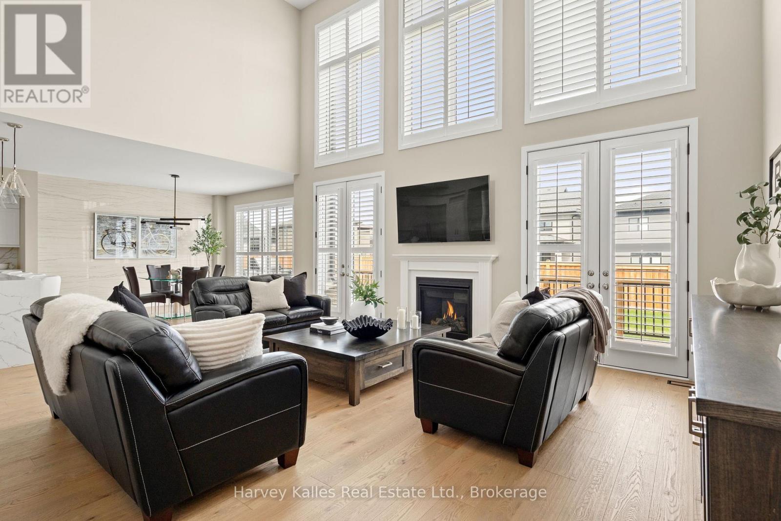 Massive windows & high ceilings - 163 Springside Crescent, Blue Mountains, ON - Indoor Photo Showing Living Room With Fireplace