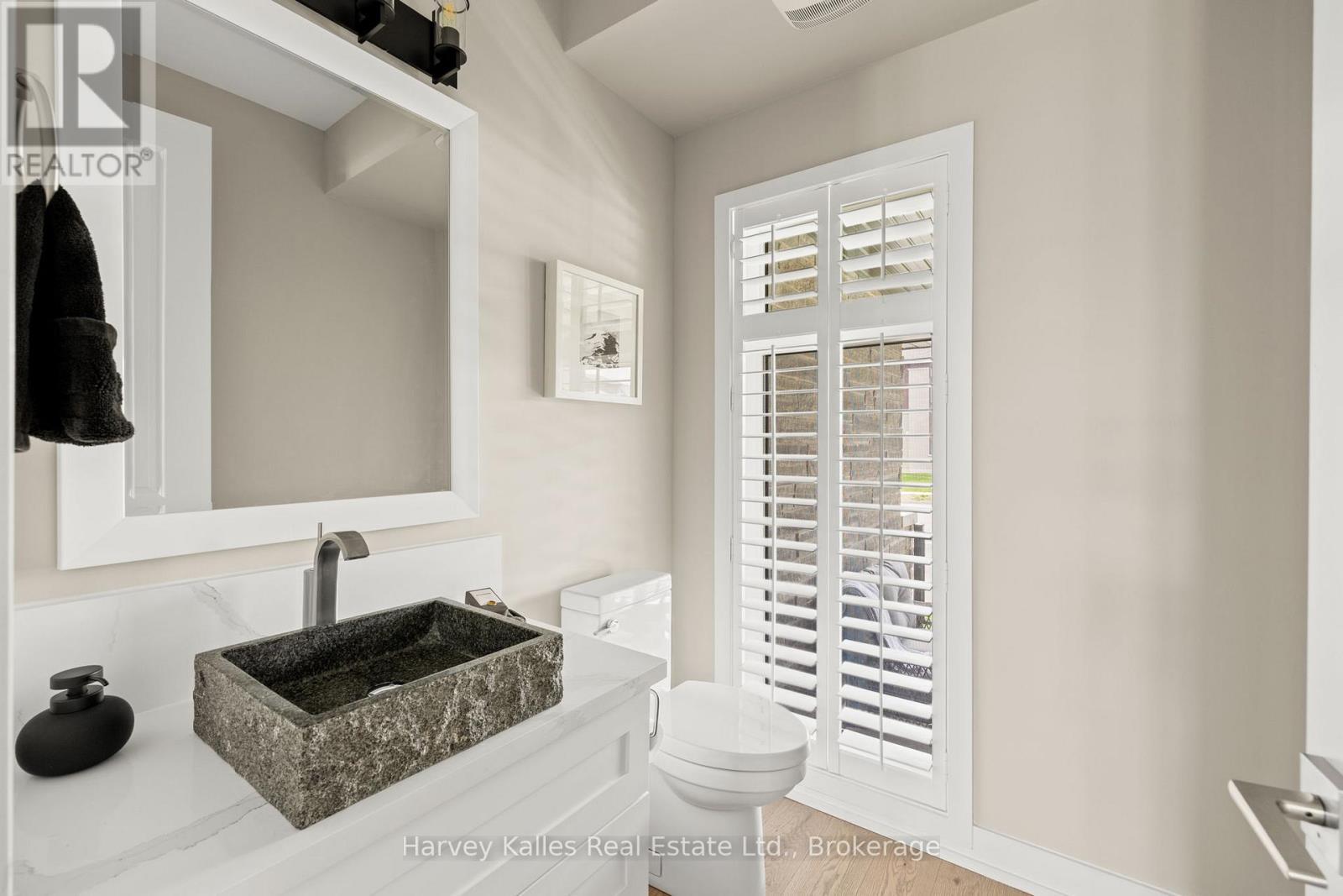 Main level powder room with stunning vessel sink - 163 Springside Crescent, Blue Mountains, ON - Indoor Photo Showing Bathroom