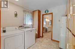 laundry room with loads of storage - 