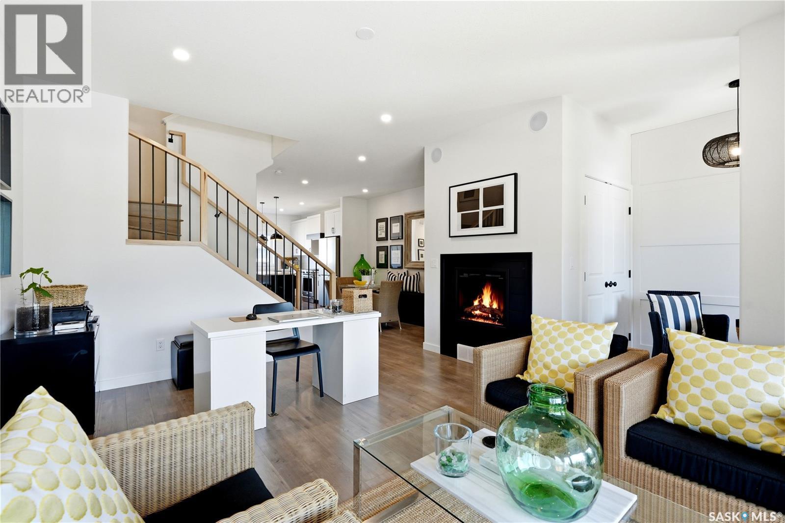 1039 4Th Street E, Saskatoon, SK - Indoor Photo Showing Living Room With Fireplace