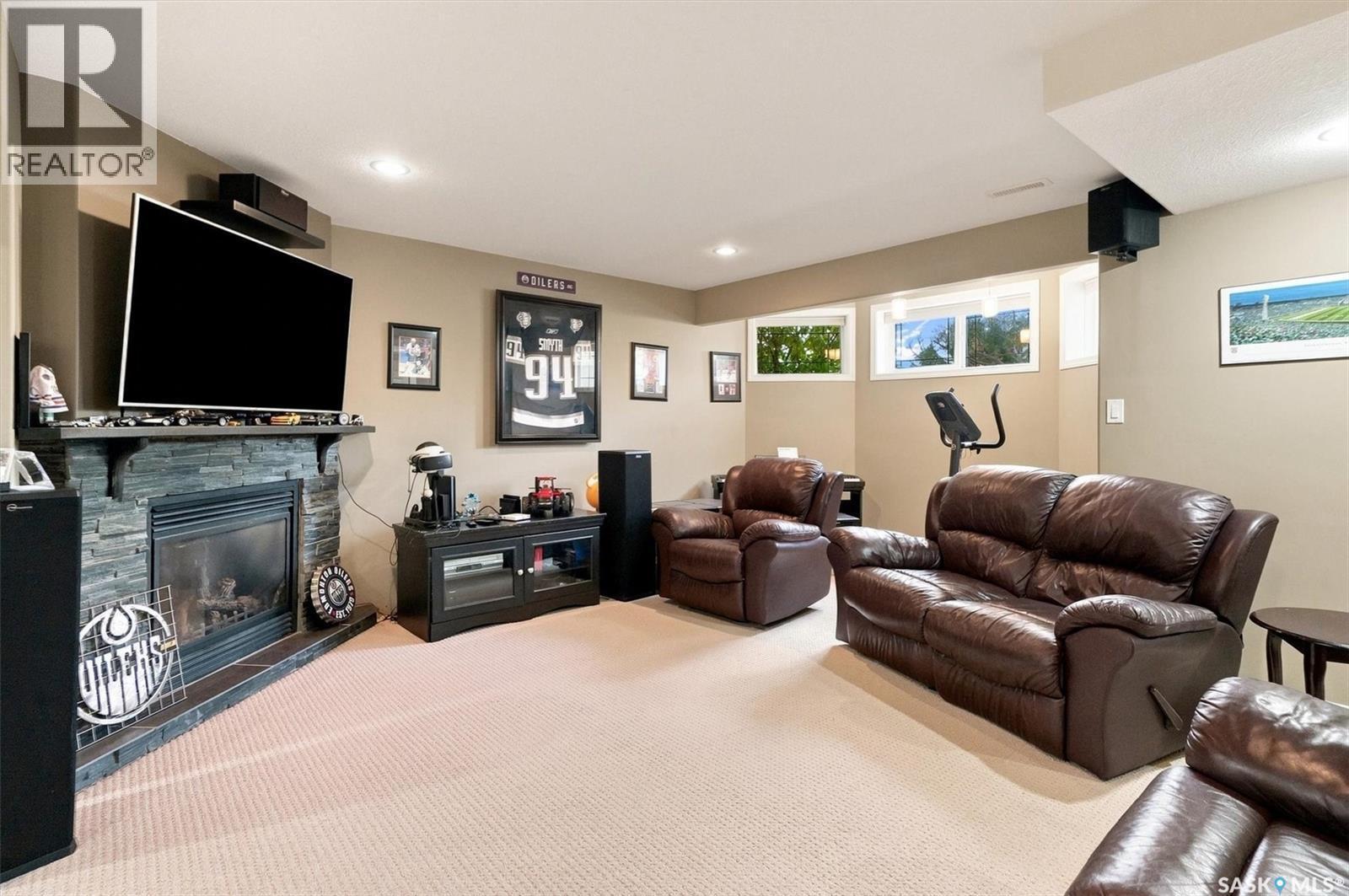 211 Crenshaw Way, Warman, SK - Indoor Photo Showing Other Room With Fireplace
