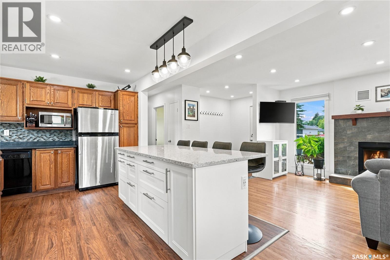 39 Brown Crescent, Saskatoon, SK - Indoor Photo Showing Kitchen With Fireplace
