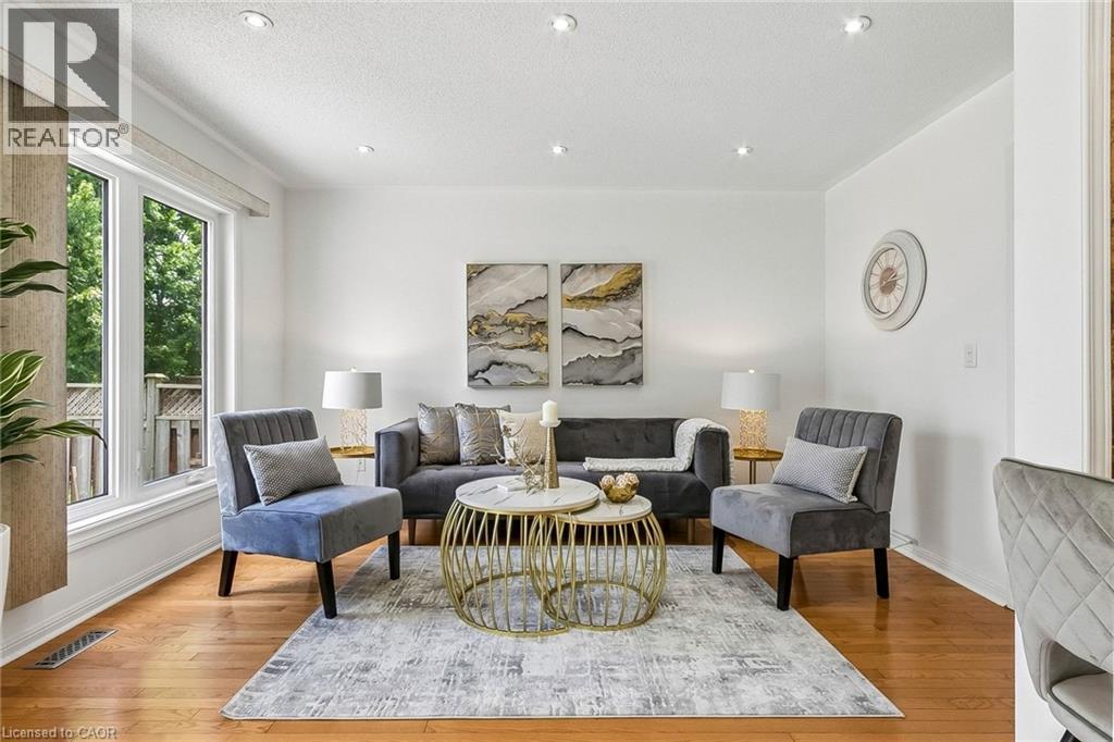 Recessed lighting, wood-finish flooring, and white walls with crown molding - 1373 Quest Circle, Mississauga, ON