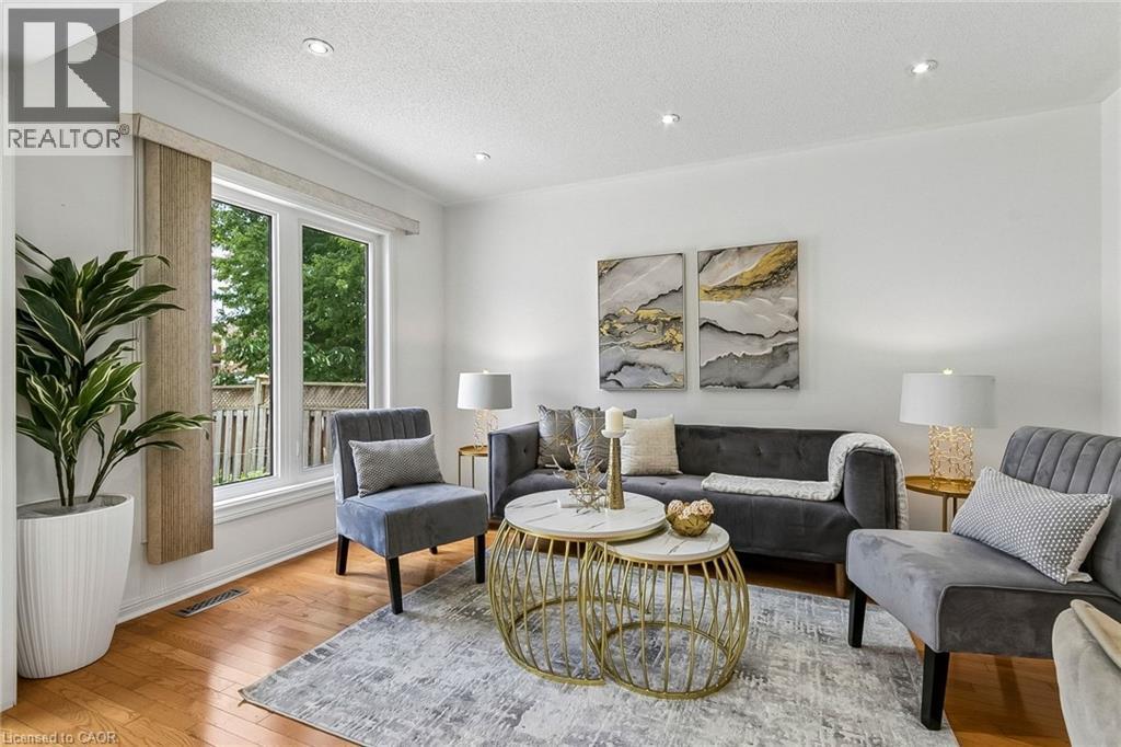 Recessed ceiling lighting, wood-finish flooring, and white painted walls - 1373 Quest Circle, Mississauga, ON