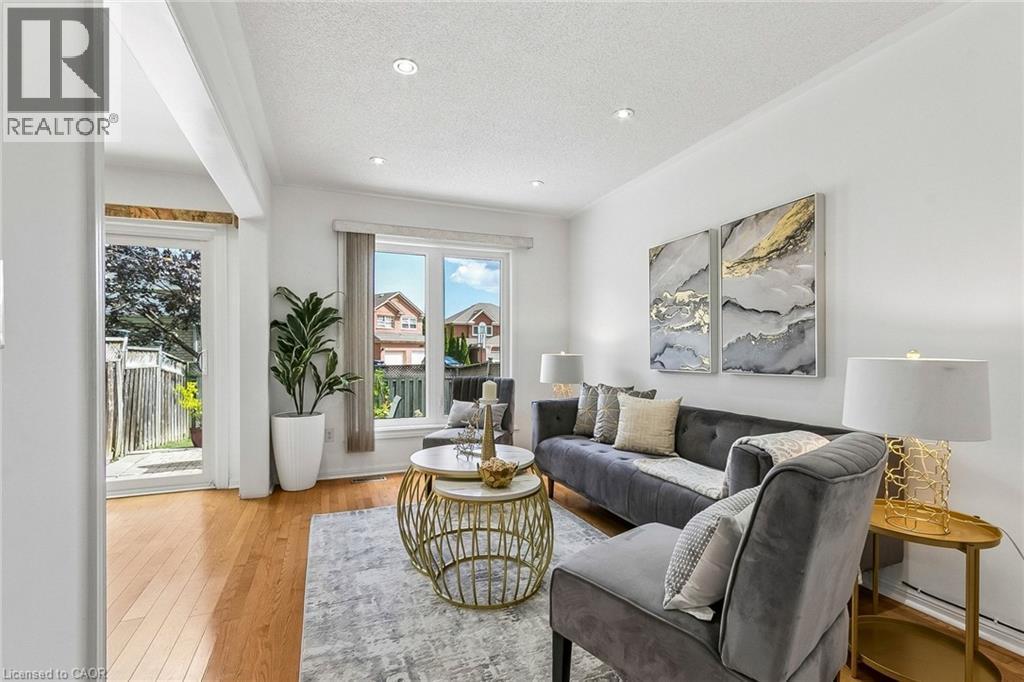 Recessed lighting, wood-finish flooring, white walls, and a sliding glass door - 1373 Quest Circle, Mississauga, ON
