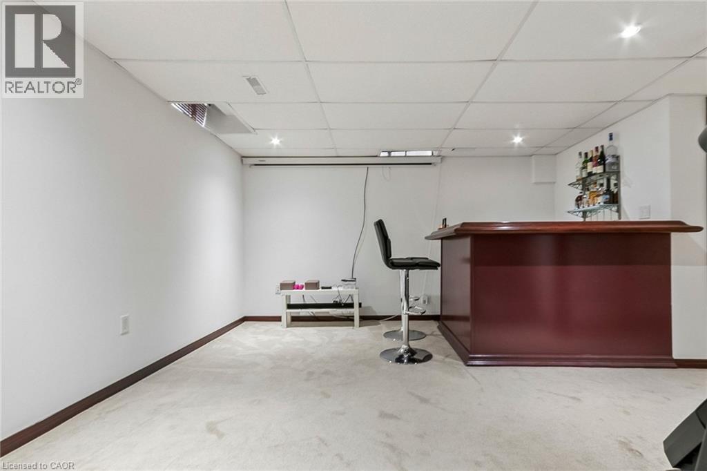 Finished basement featuring a built-in bar, recessed lighting, and carpet flooring - 1373 Quest Circle, Mississauga, ON