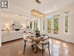 Recessed lighting, crown molding, wood-finish flooring, fireplace, and French doors -