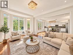 Hardwood flooring throughout, recessed lighting, and an elegant beaded chandelier -