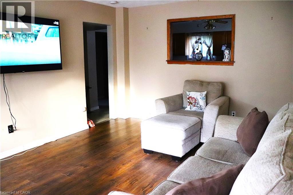 Laminate flooring in living room - 348 Weir Street N, Hamilton, ON