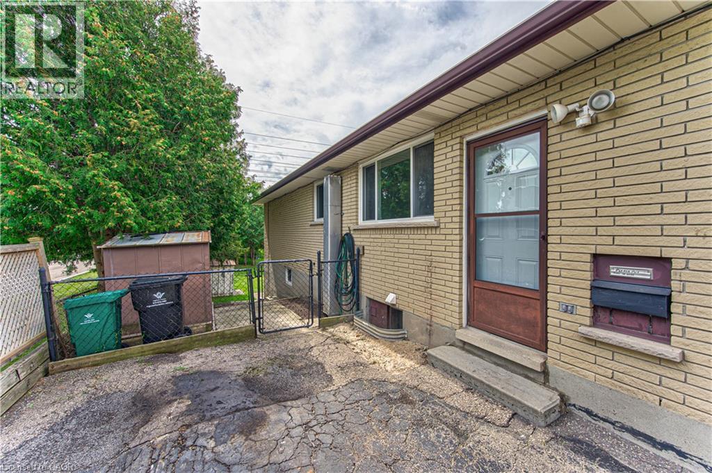 Side door entry to basement level and main floor kitchen & dining area - 21 Vicmount Drive, Kitchener, ON