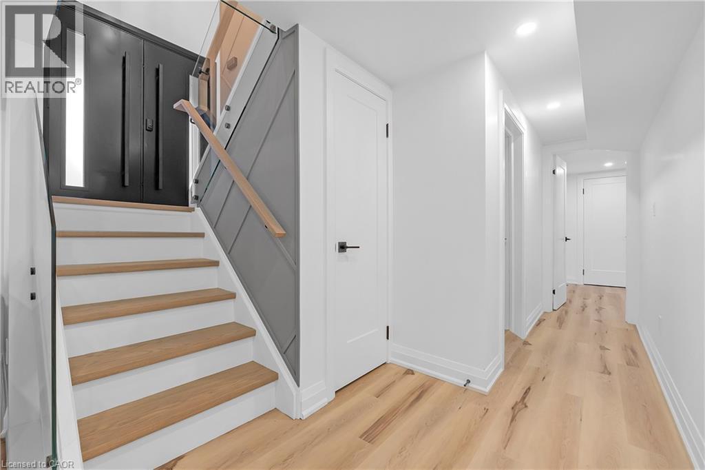 White interior walls with recessed lighting - 4236 Longmoor Drive, Burlington, ON