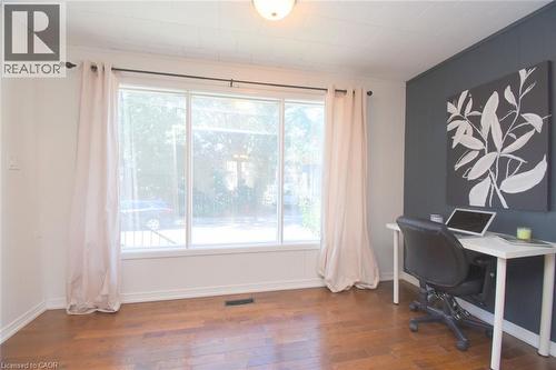 Hardwood flooring, recessed lighting, and a large picture window with white trim - 35 Tisdale Street S, Hamilton, ON 