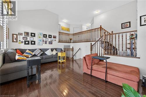 Living area with wood-type flooring and a high ceiling - 97 Sirente Drive, Hamilton, ON 